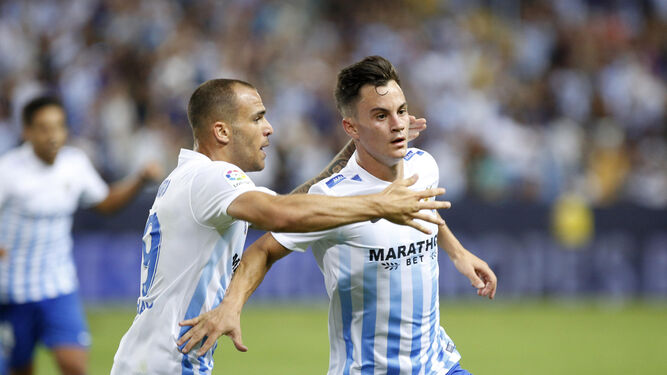 Juanpi celebra junto a Sandro el gol que marcó al Osasuna