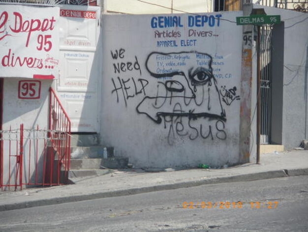grafiti que representa el perfil del pa&iacute;s llorando y rezando. El ojo de la Isla de Gonaives.