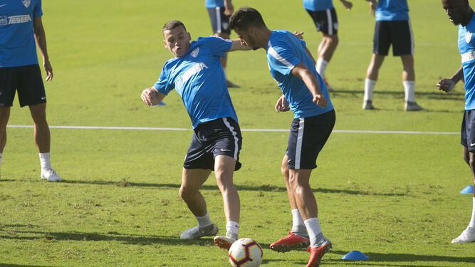 Harper y Juankar, en un entrenamiento del Málaga CF.