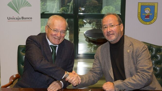 Firma del acuerdo entre Unicaja Banco y Mensajeros de la Paz