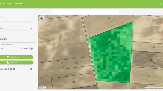 Imagen de un campo de cultivo, obtenida desde un satélite, en la que se aprecian distintos colores de las parcelas.