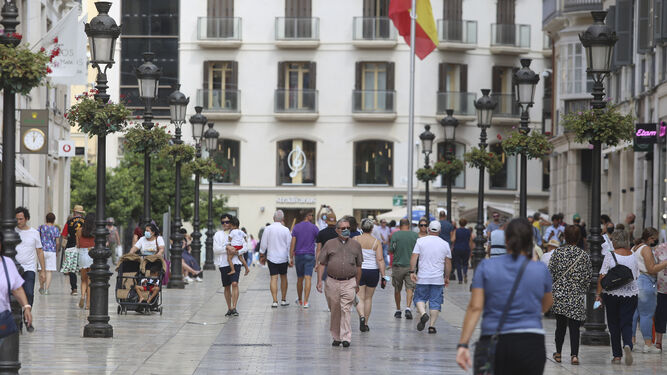 Personas por el centro de Málaga.