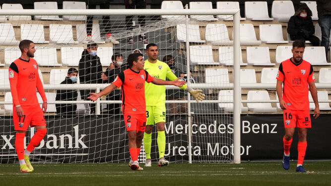 Los jugadores del Málaga CF tras el 1-0 del Burgos